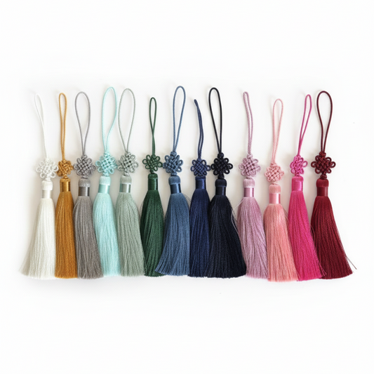 Set of colorful tassels on a white background